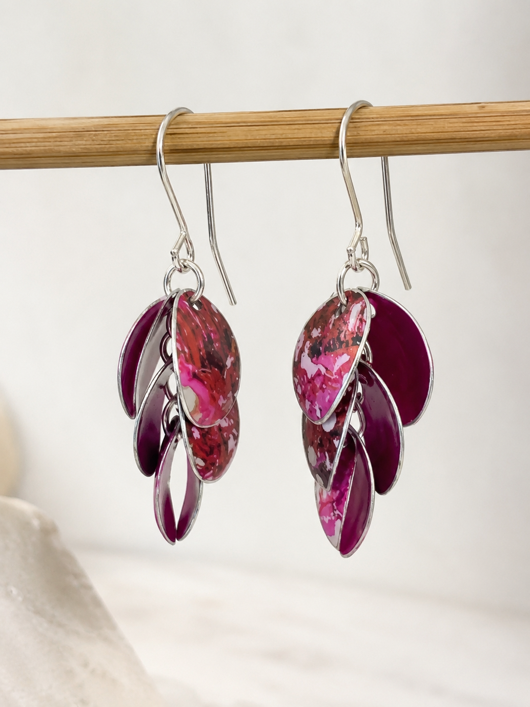 Handmade Cascade drop earrings in berry pink, plum and red printed anodised aluminium with sterling silver ear wires.