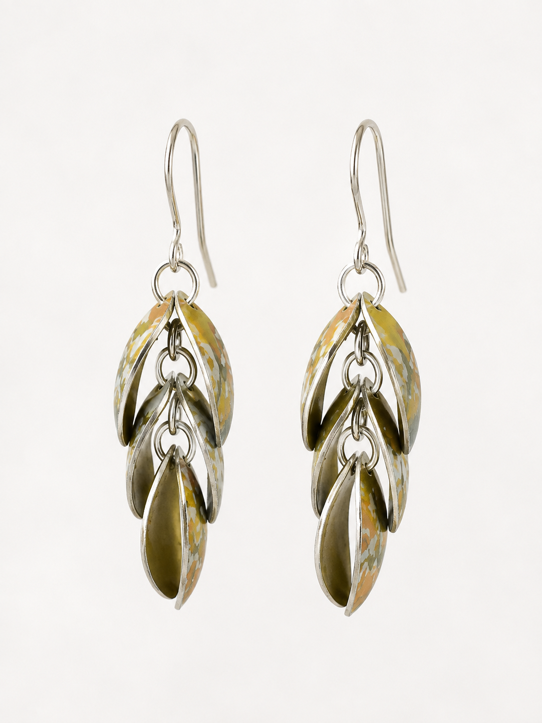 Handmade Golden Ochre Cascade drop earrings in yellow, ochre and soft green printed anodised aluminium with sterling silver ear wires.