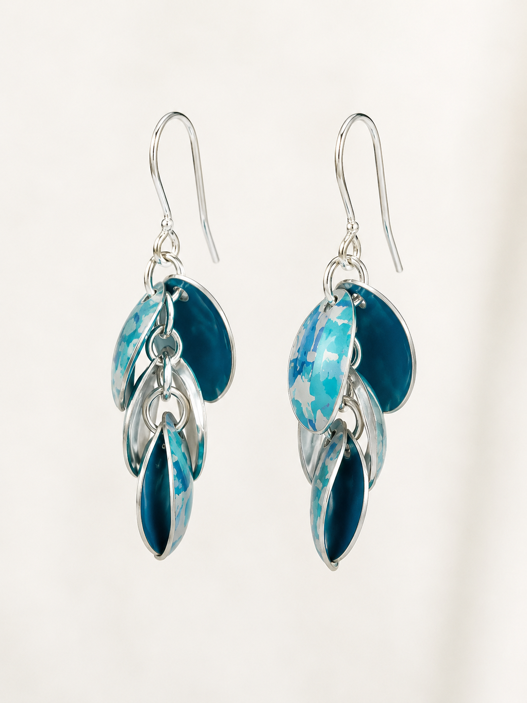 Handmade Ocean Blue Cascade drop earrings in turquoise printed anodised aluminium with sterling silver elements and ear wires.