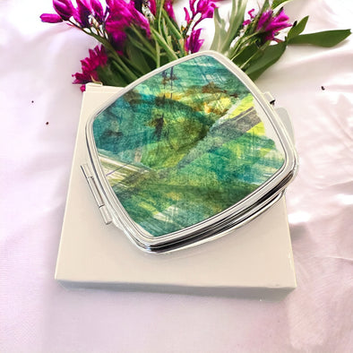 Compact Pocket Mirror Hand painted using textile powdered dyes. The perfect addition to your everyday essentials. Featuring two mirrors, it is ideal for whilst you are on the go. size 7cm x 7 cm