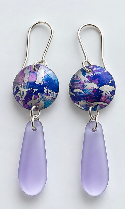  Handmade lilac sea glass and blue violet printed aluminium drop earrings by Rachel Stowe
The purple/lilac pair is quite distinctive and feels a little softer than the blues.